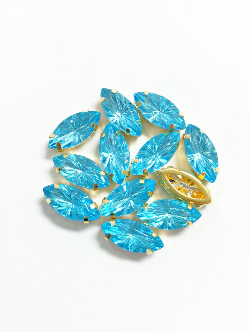 12 x 7x15mm Navette Sky Blue Rhinestones in Gold Sew-on Setting