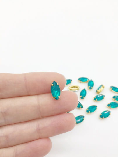 12 x 6x12mm Blue-green Opal Navette Rhinestones in Gold Tone Sew-on Setting (3845)