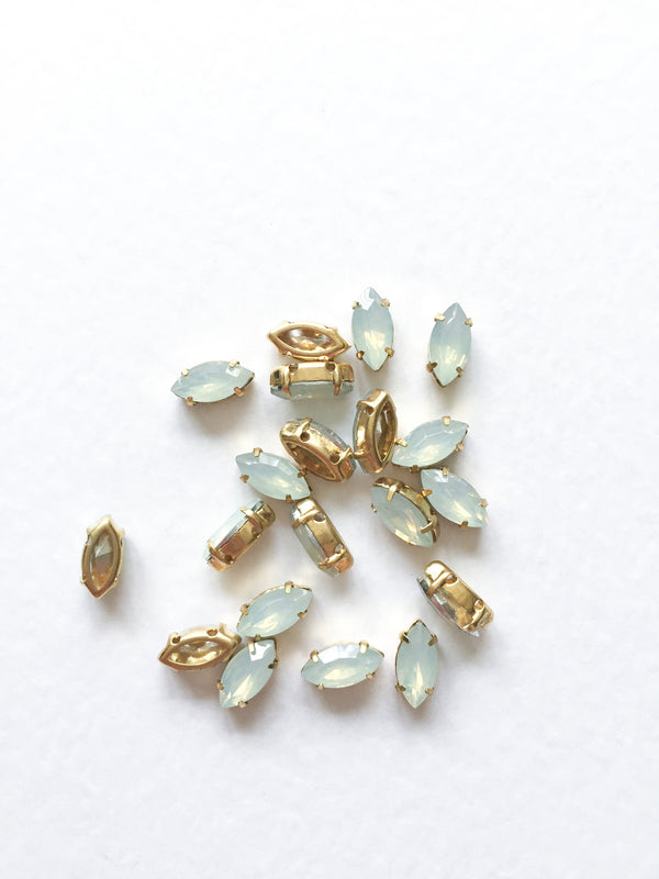 24 x 5x10mm White Opal Navette Rhinestones in Gold Tone Sew-on Setting (3631)