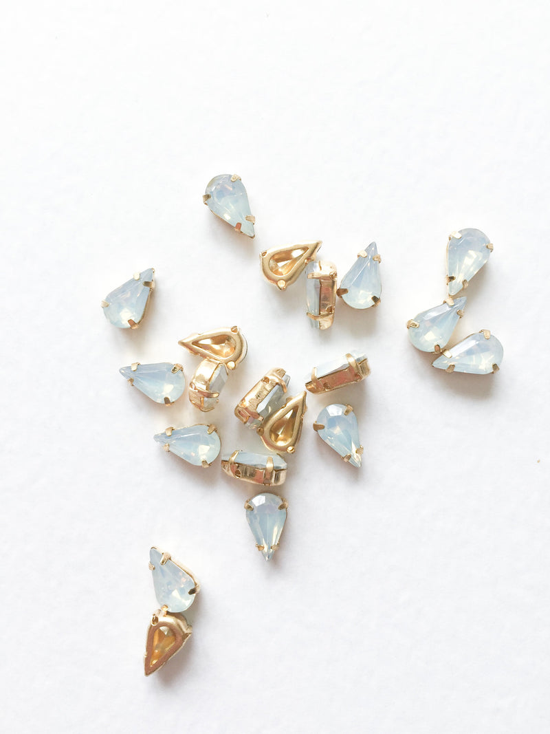 24 x 6x10mm Teardrop White Opal Rhinestones in Gold Tone Sew-on Setting (3621)