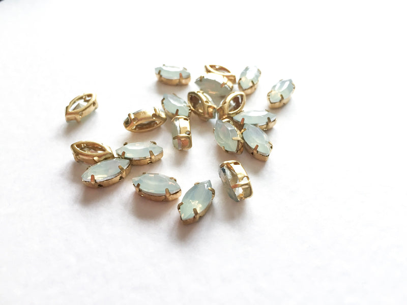 24 x 5x10mm White Opal Navette Rhinestones in Gold Tone Sew-on Setting (3631)