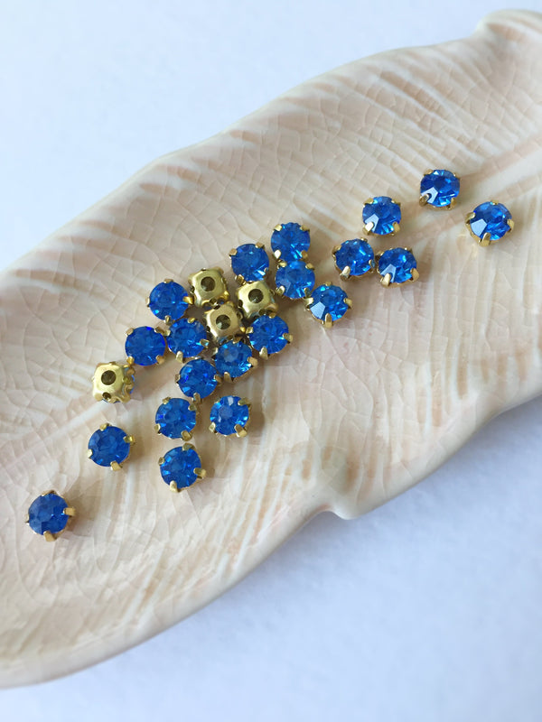 48 x Light Sapphire Glass Rhinestones in Gold Sew-on Setting, 4mm or 5mm