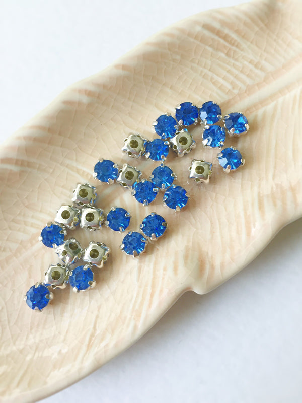 48 x Light Sapphire Glass Rhinestones in Silver Sew-on Setting, 4mm or 5mm