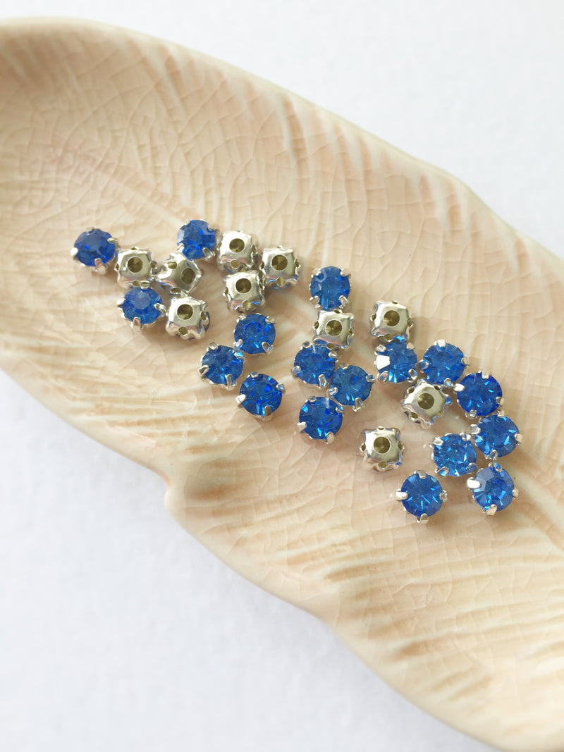 48 x Light Sapphire Glass Rhinestones in Silver Sew-on Setting, 4mm or 5mm