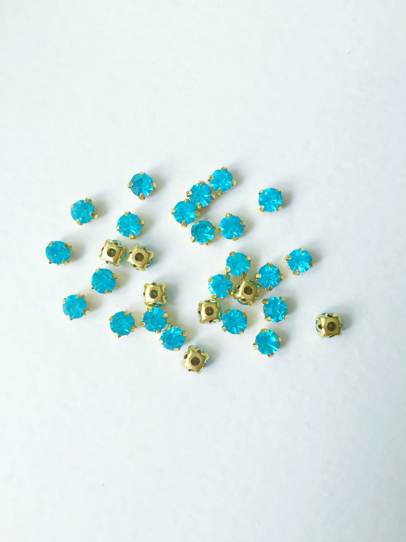 48 x Aquamarine Glass Rhinestones in Gold Sew-on Setting, 4mm or 5mm