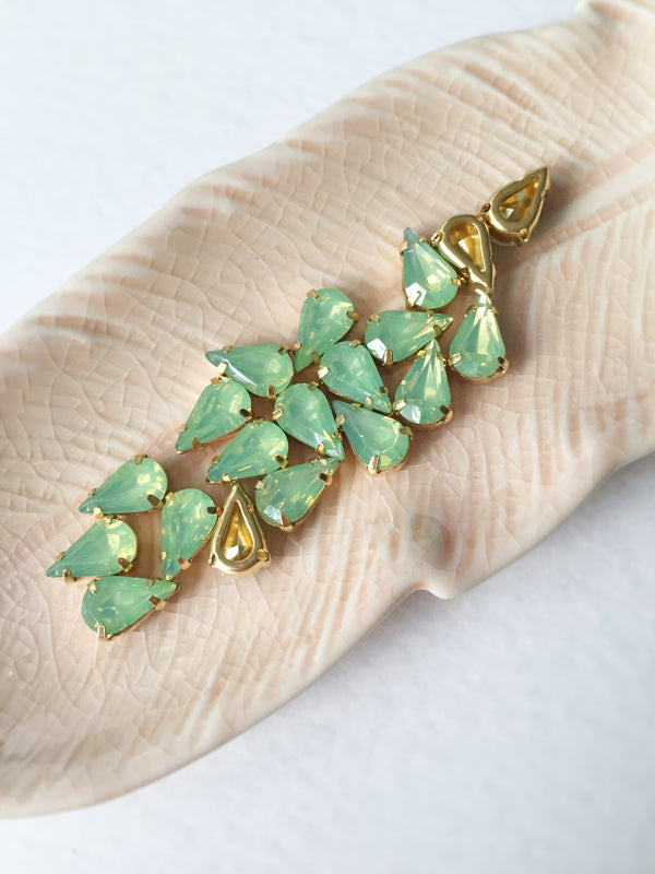 24 x 6x10mm Teardrop Green Opal Rhinestones in Gold Tone Sew-on Setting (3638)