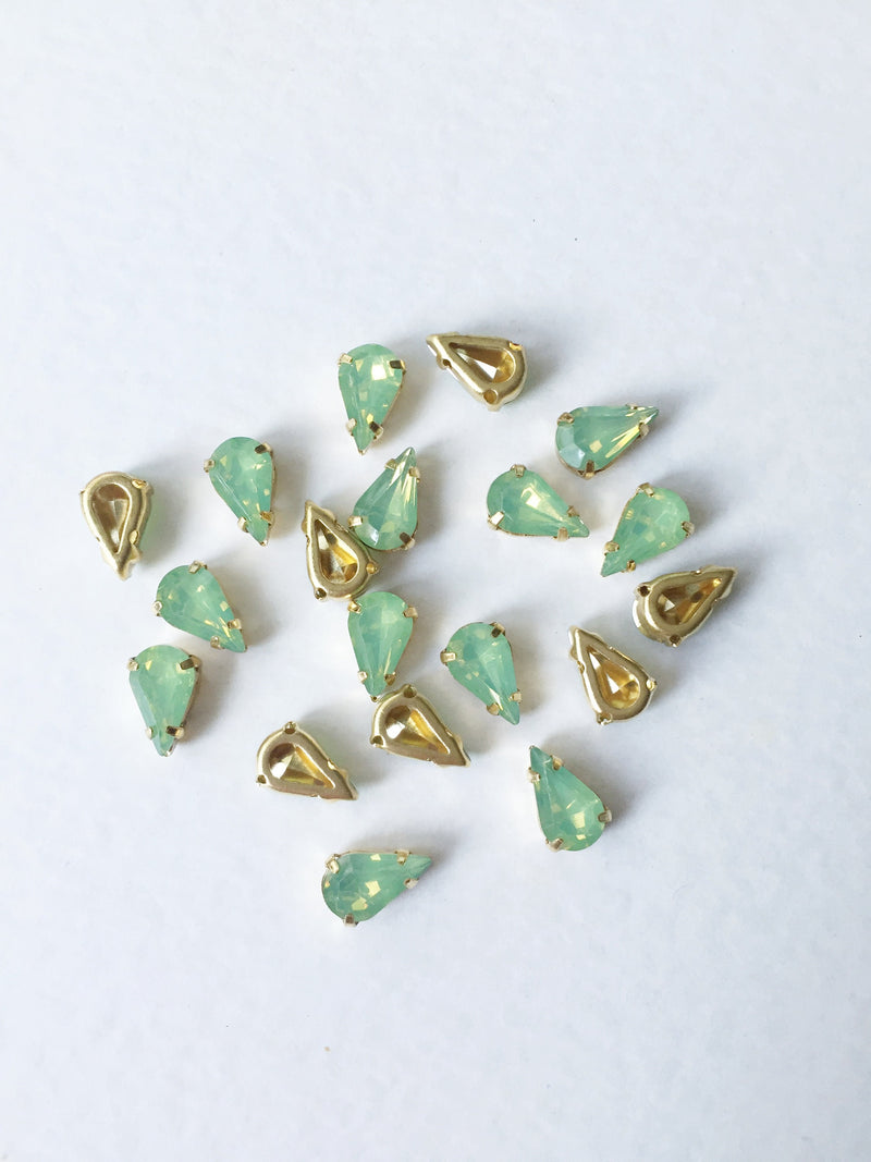 24 x 6x10mm Teardrop Green Opal Rhinestones in Gold Tone Sew-on Setting (3638)