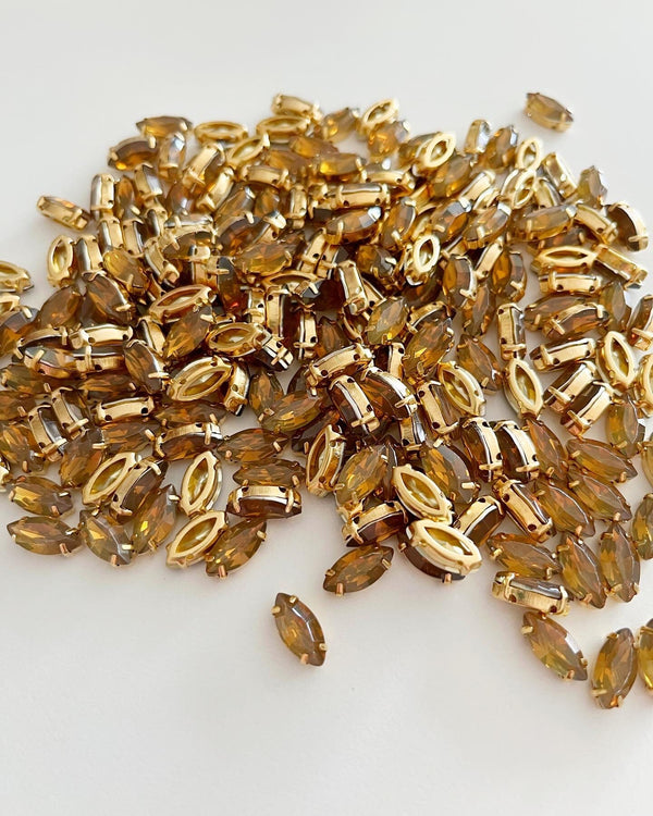 12 x 6x12mm Coffee Opal Navette Rhinestones in Gold Sew-on Setting (2776)